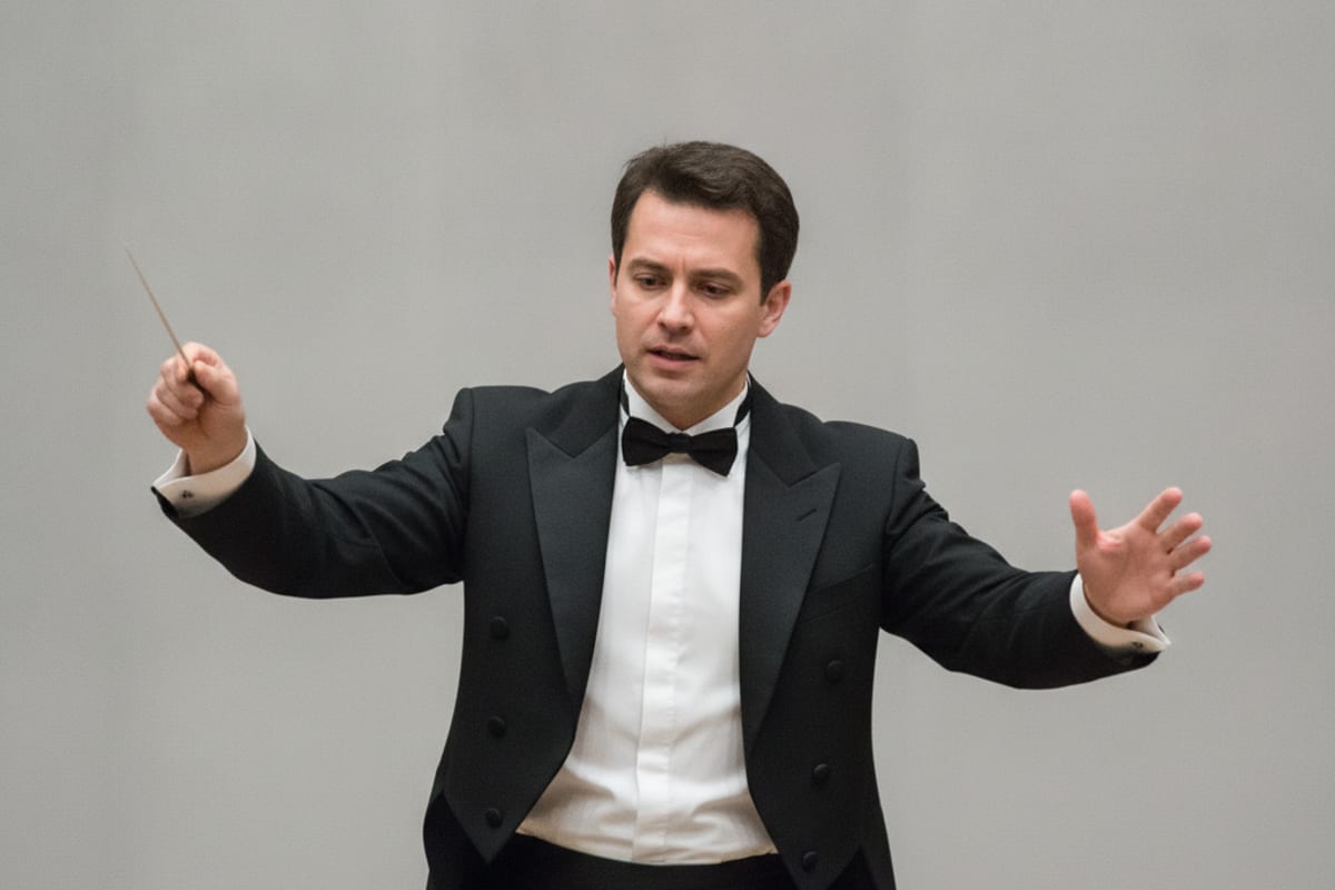 conductor — shown at the train station
