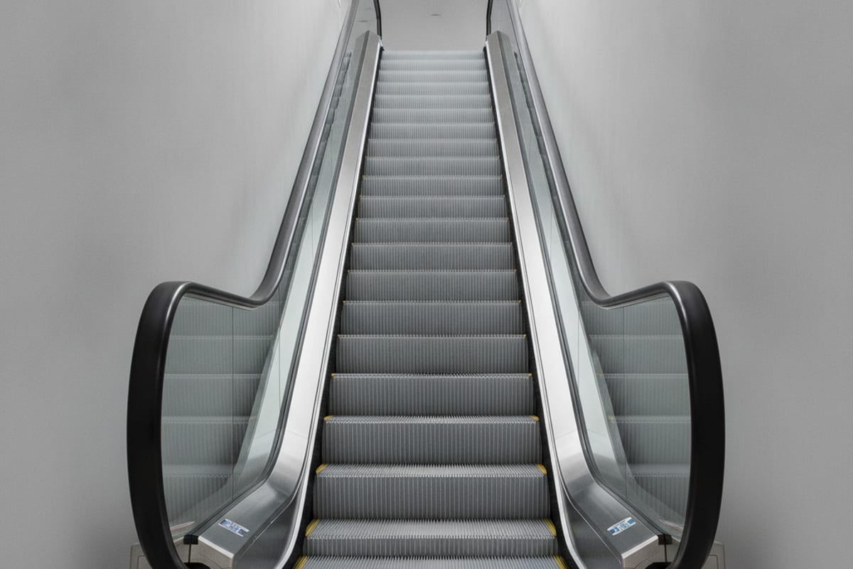 escalator — shown at the train station